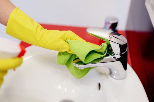 Trained carpet cleaner in E2 applying professional safety practices