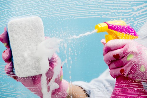 Technician using ventilation and chemical controls during carpet cleaning
