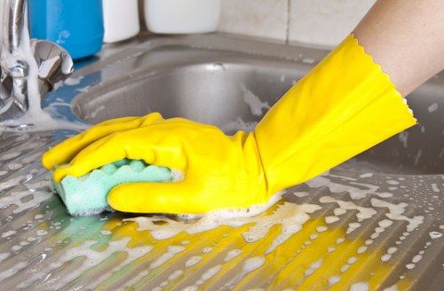 Kitchen and bathroom cleaning during a move-in clean in East London